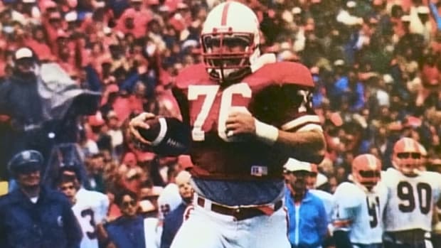 Defensive tackle Chris Spachman's 38-yard interception return puts the Huskers over the 50-point mark against the Fighting Illini. 